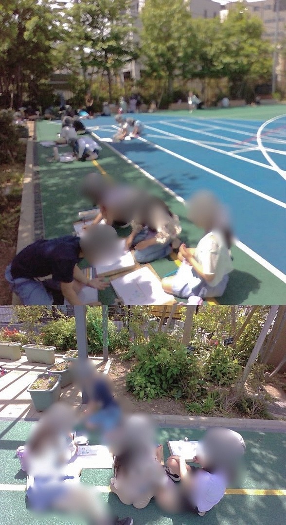 校庭で絵を描く児童2